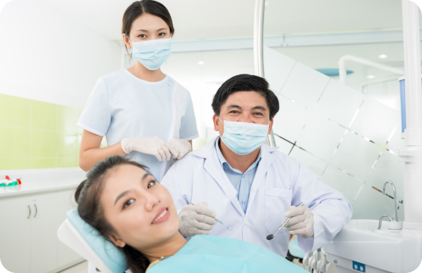 Orthodontist performing a wire adjustment on a patient’s metal braces as part of regular treatment
