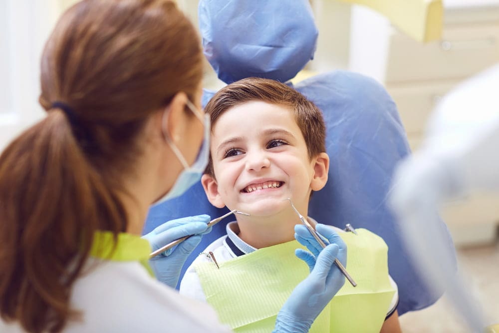 Orthodontist in Austin and Houston, teaching a young patient about their new palate expander