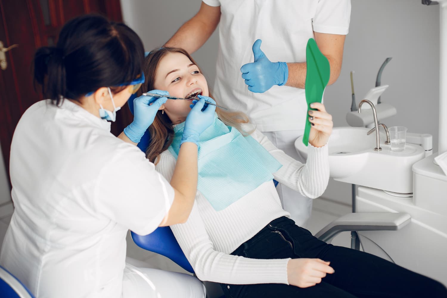 Orthodontist adjusting a patient's herbst appliance in Austin and Houston TX