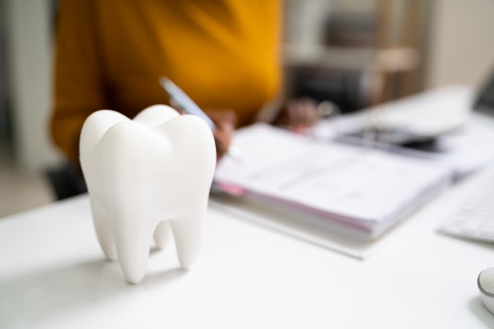 White teeth figures on top of the table at Best Orthodontics