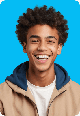 A person with curly hair is smiling, wearing a tan jacket with a blue hood and a white shirt, against a bright blue background.