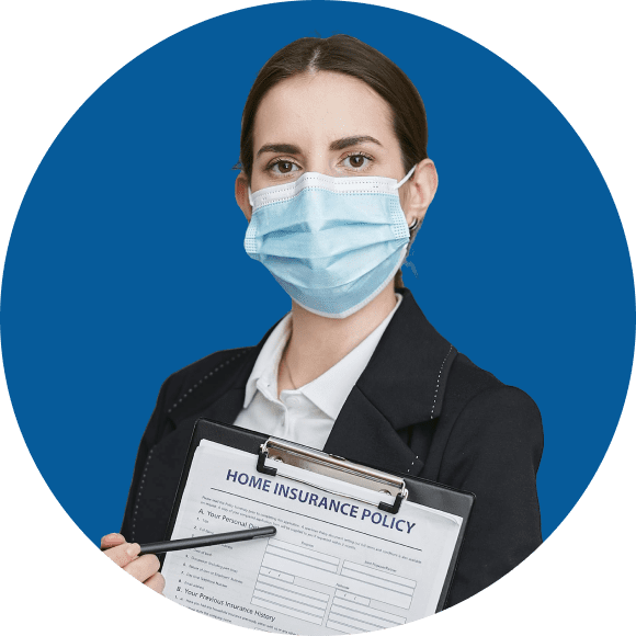 Person wearing a face mask holds a clipboard with a home insurance policy form against a blue background.