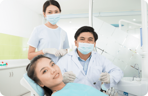 Orthodontist performing a wire adjustment on a patient’s metal braces as part of regular treatment