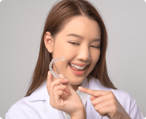 Young woman learning about affordable Invisalign payment plans
